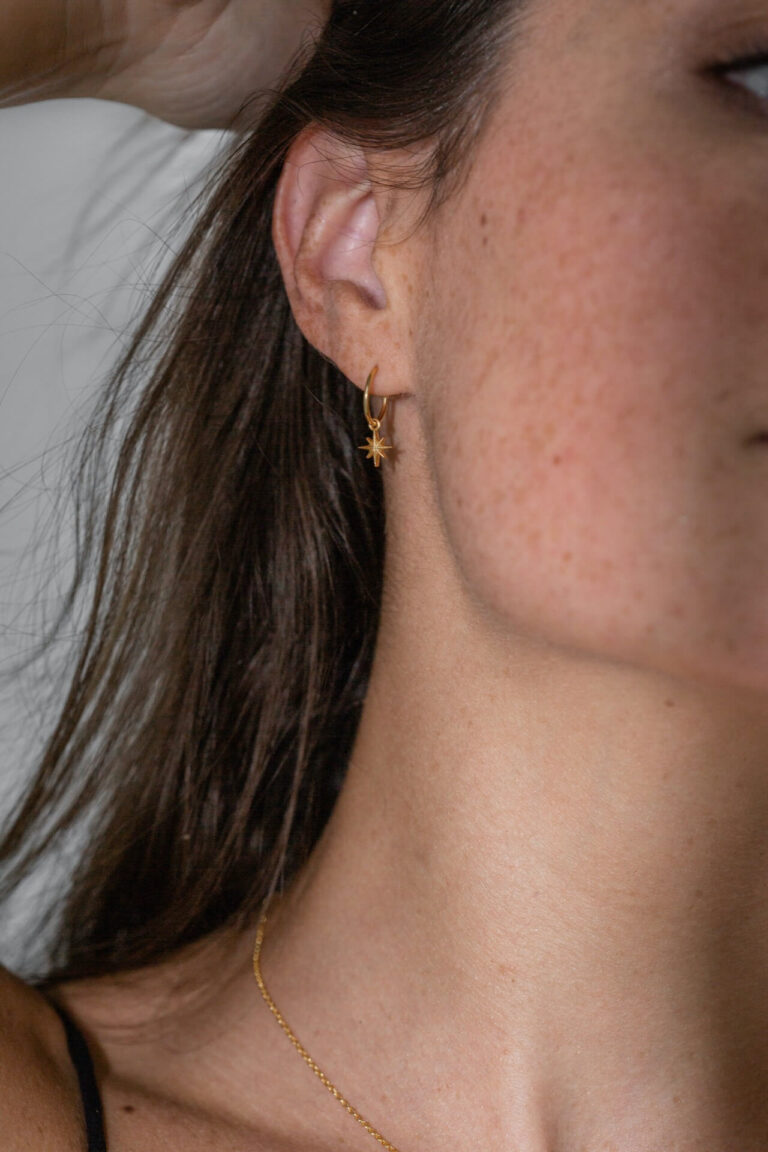 Gold Starlight Mini Hoop Earrings worn by model