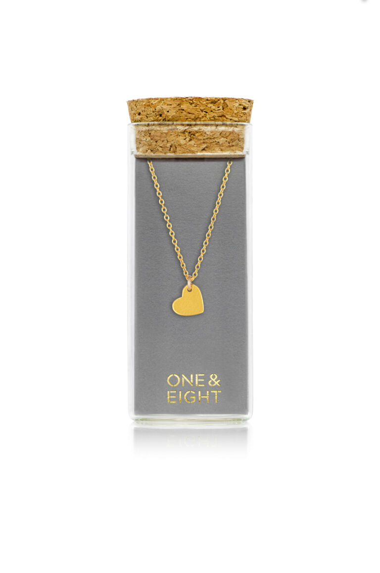 Gold Heart Amor Necklace on grey branded One & Eight card, in a glass bottle with cork lid