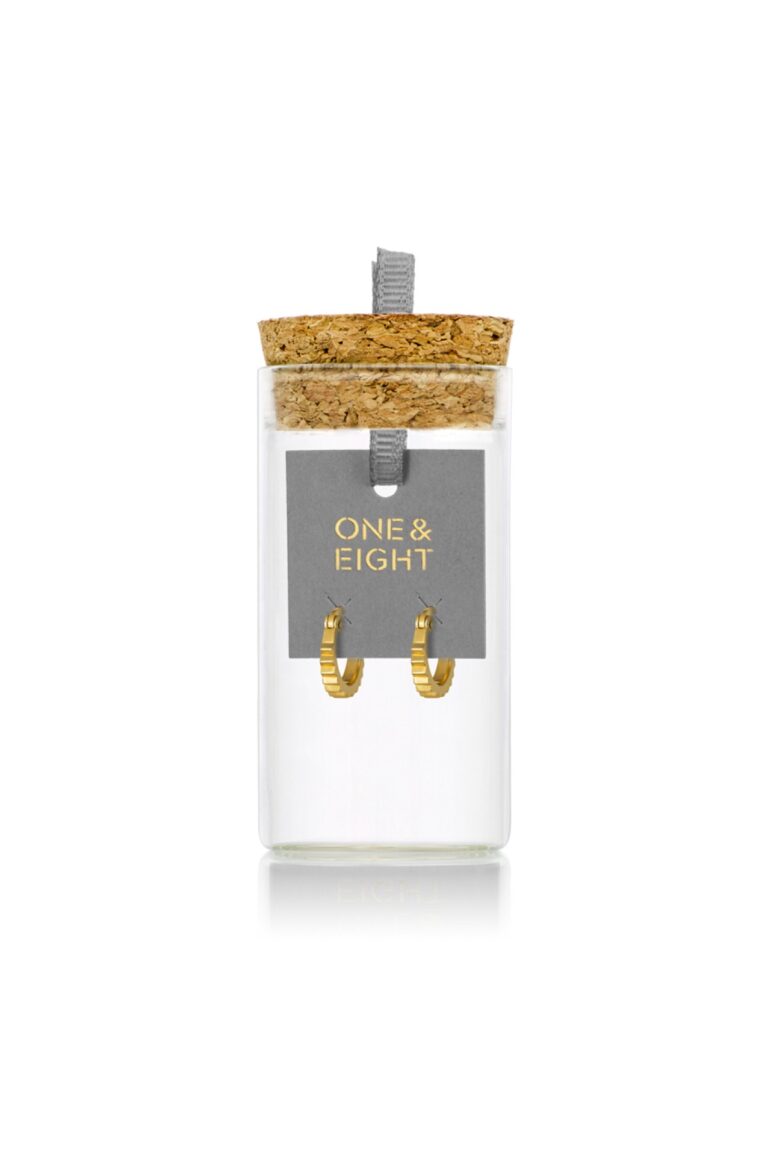 Gold Wren Ridged Hoops on grey card backing in glass bottle with cork lid