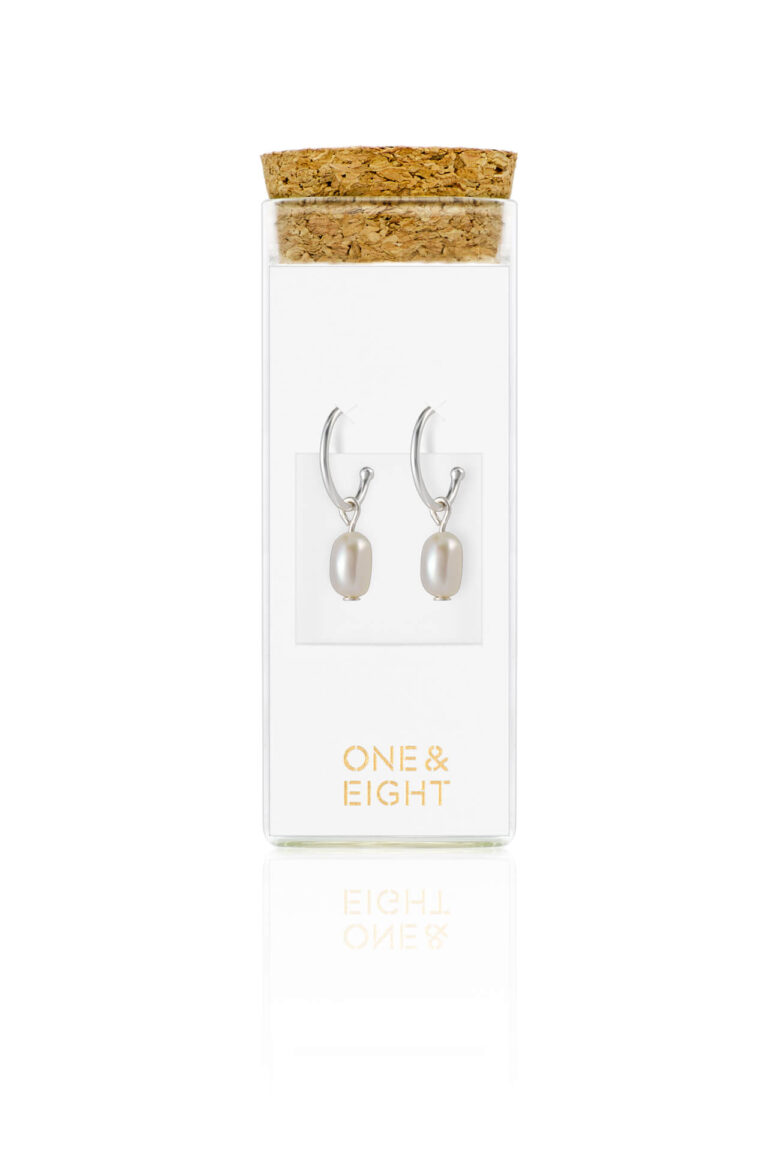 Silver Pearl Drop Earrings on white card inside a glass bottle with cork