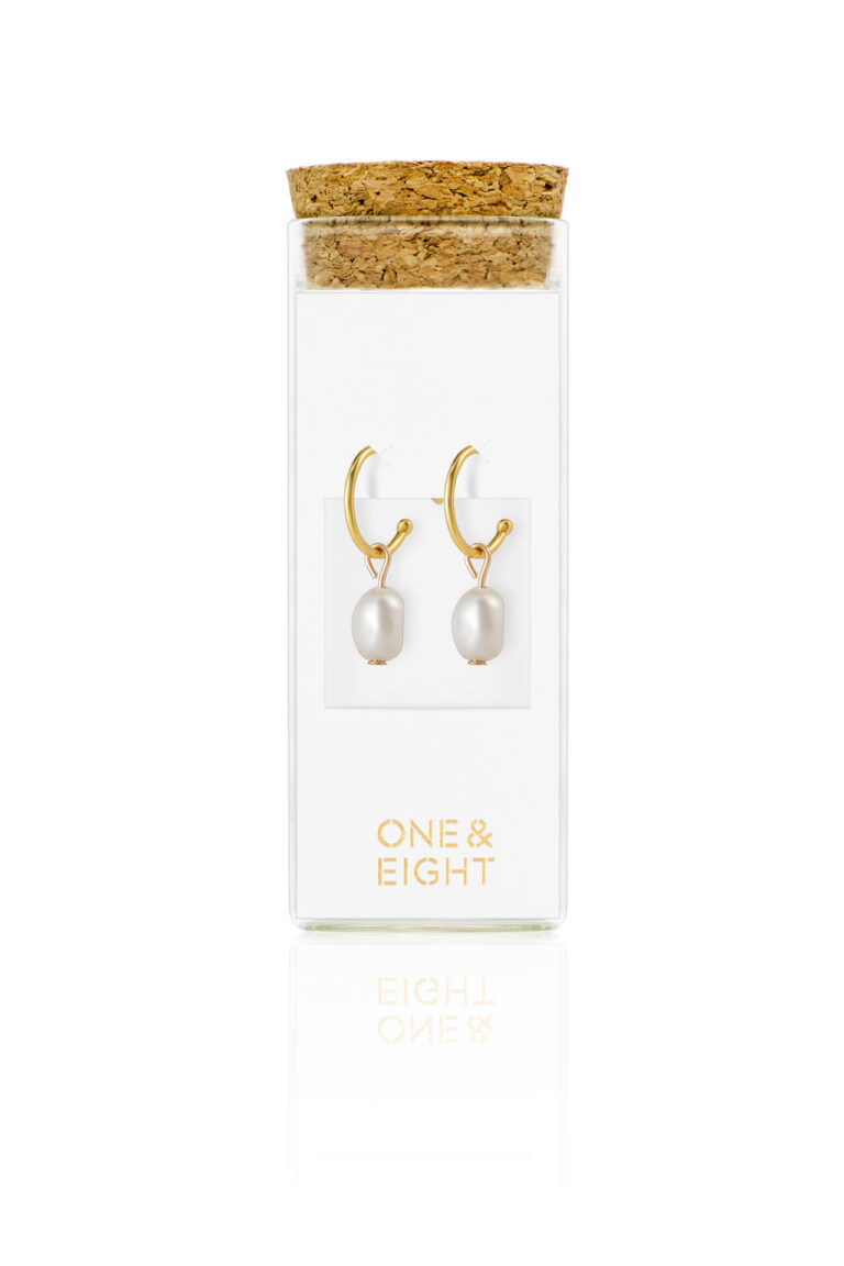 Gold Pearl Drop Earrings on white card inside a glass bottle with cork