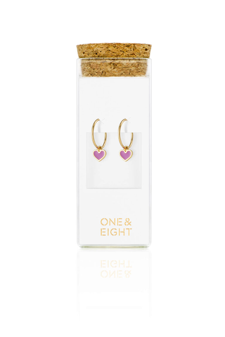 Orchid Eve Heart Huggie Hoops on white card in a glass bottle with cork lid