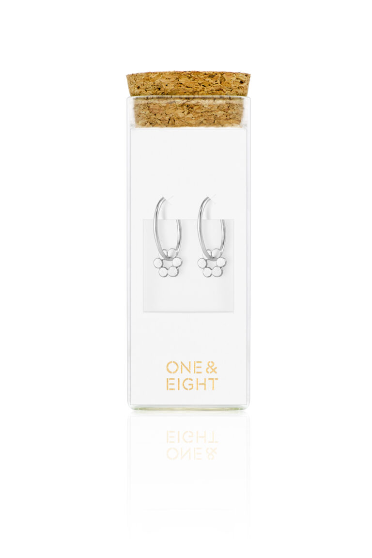 Silver Holly Fern Flower Hoop Earrings in glass bottle packaging