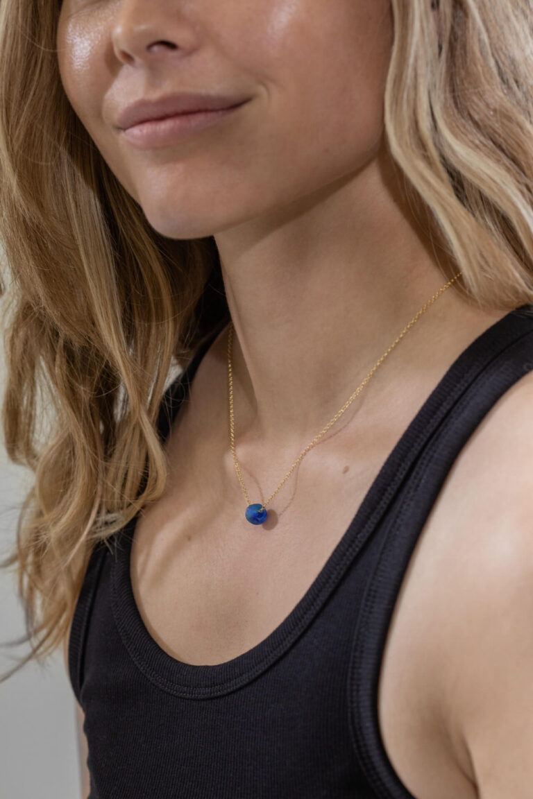 Close up of model wearing Marine Blue Glass Bead Necklace