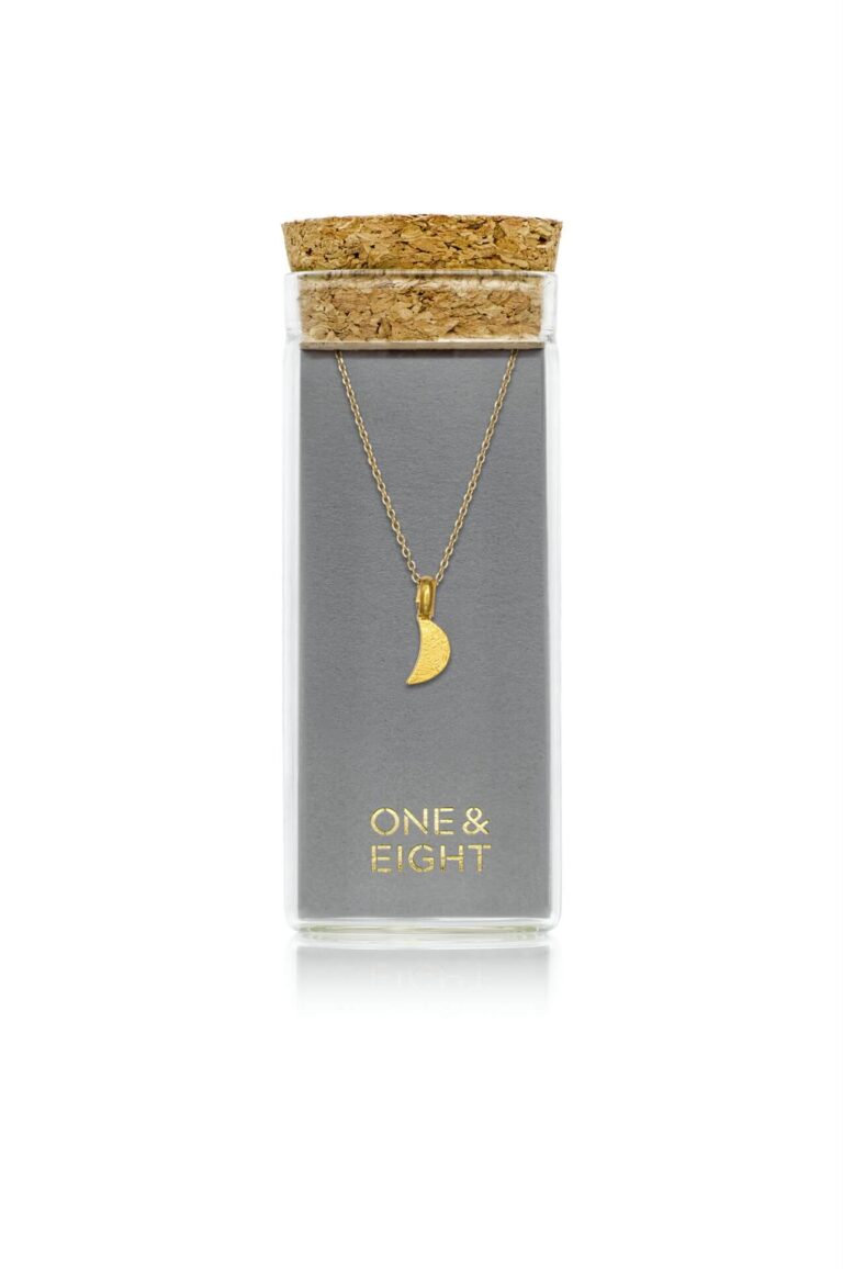 Gold Luna Moon Necklace on grey One & Eight card, in a glass bottle with cork lid