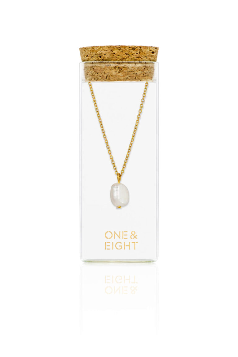 Gold Pearl Necklace in a glass bottle with cork lid