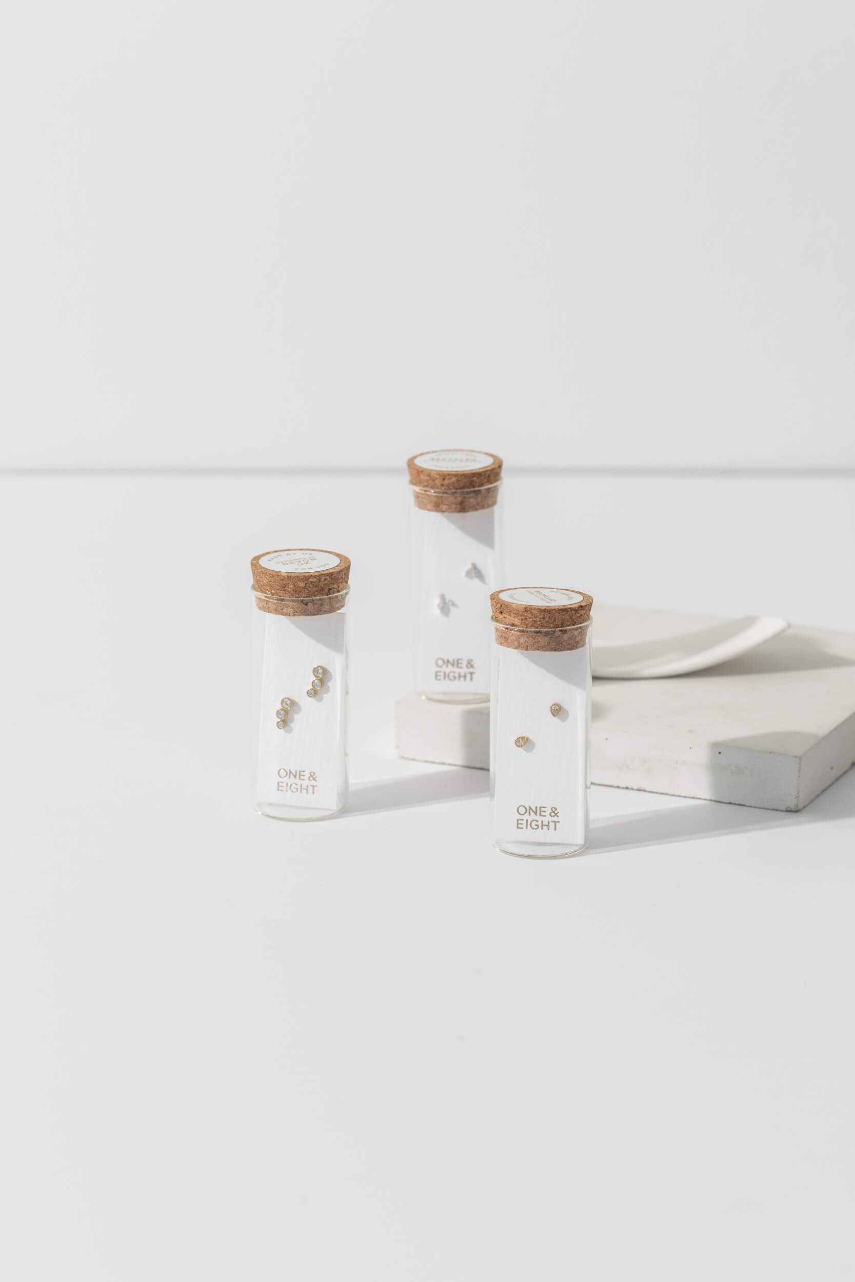 One-and-Eight-AW25-2823 2825 2818 Triple Crystal Climber Studs Champagne Pear Studs Aquamarine Leaf Studs Lifestyle Web Size 3