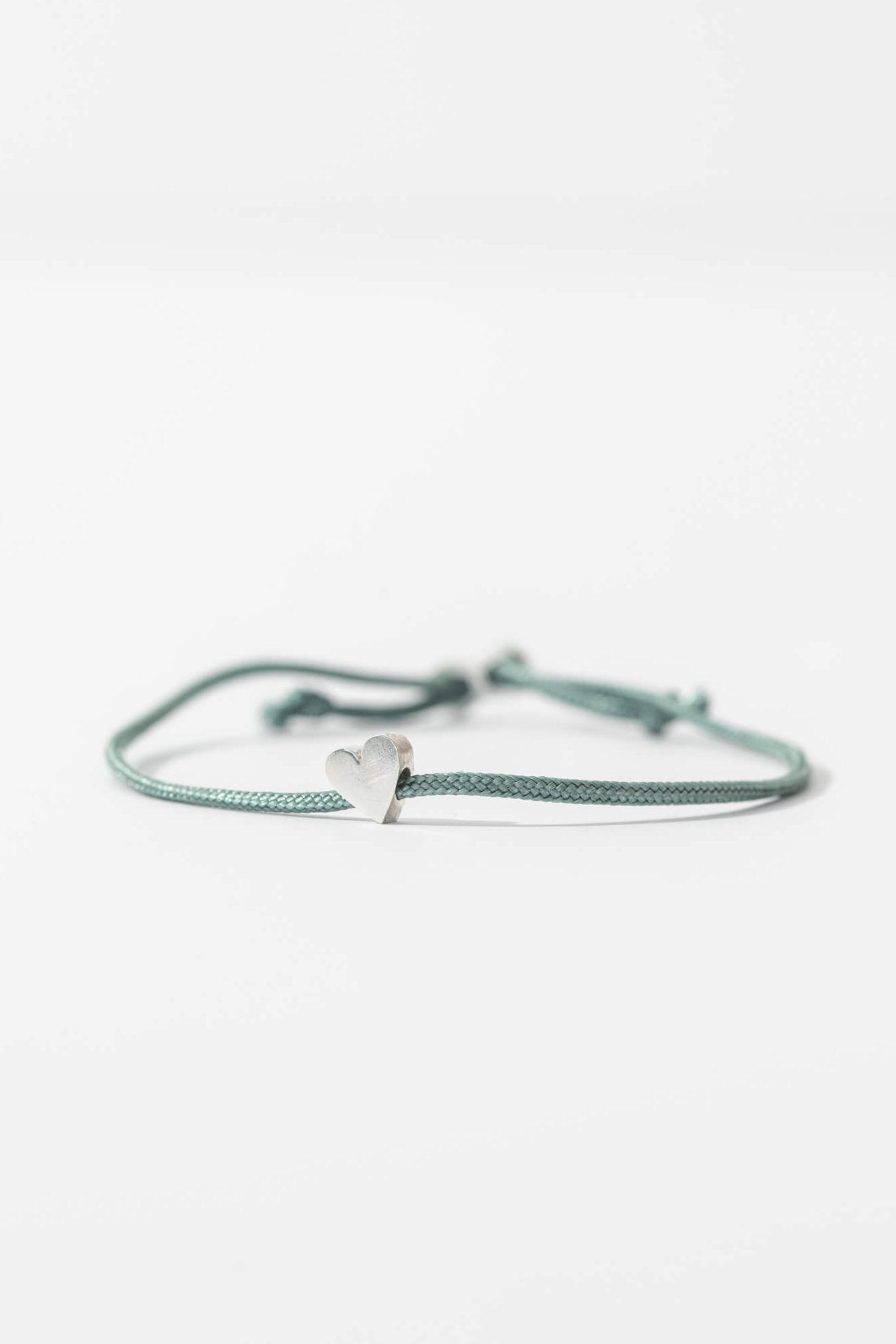 One-and-Eight-AW25-GV Silver Heart on Sage Cord Bracelet Lifestyle Web Size 2