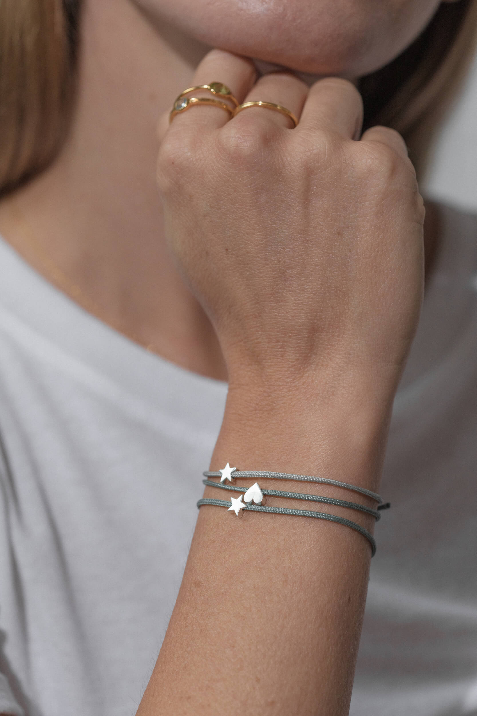 One-and-Eight-GV Silver Star on Sage Cord Bracelet Silver Star on Grey Cord Bracelet Silver Heart on Sage Cord Bracelet Model Web Size 5-AW25